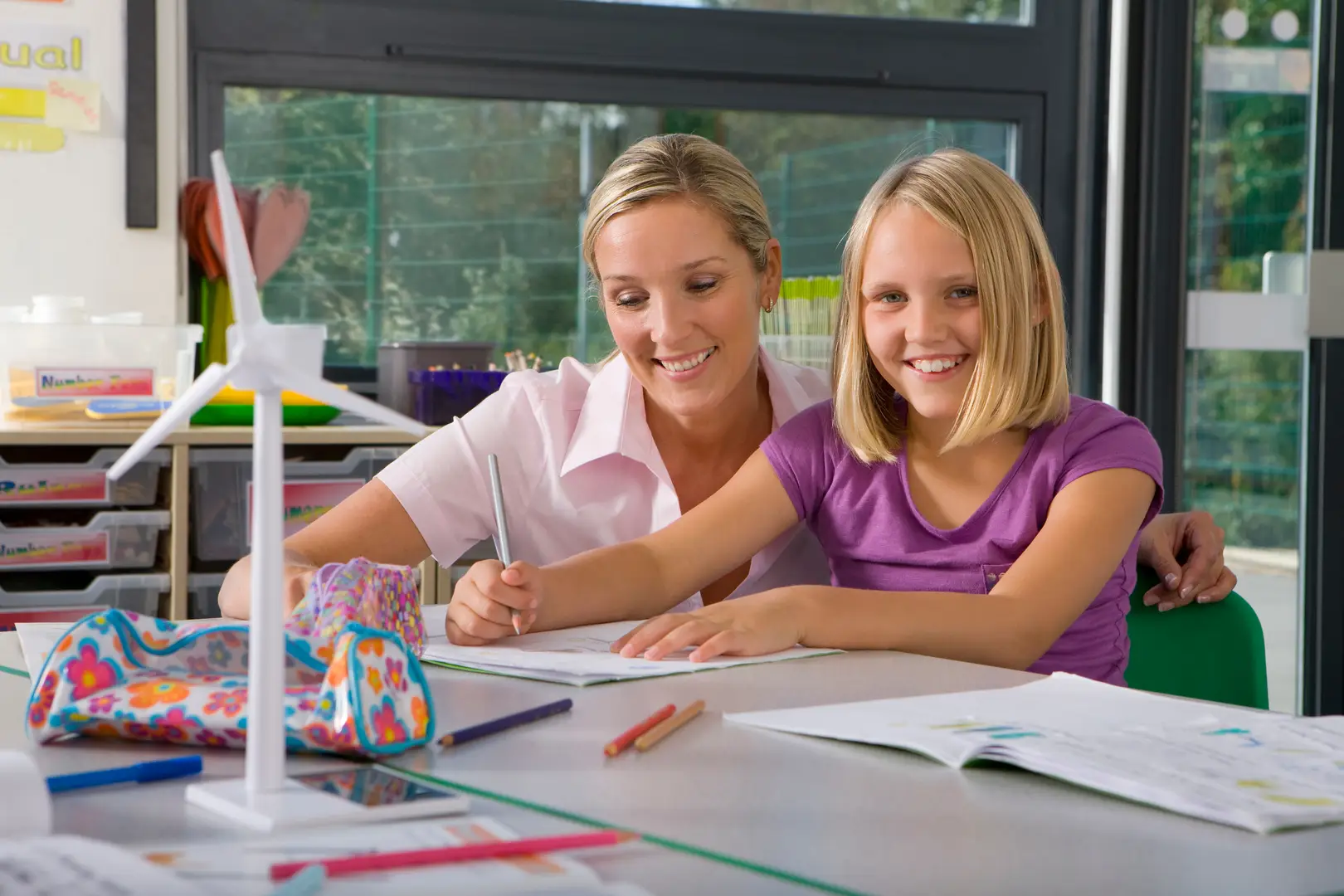 Tutor and pupil working through a school task together