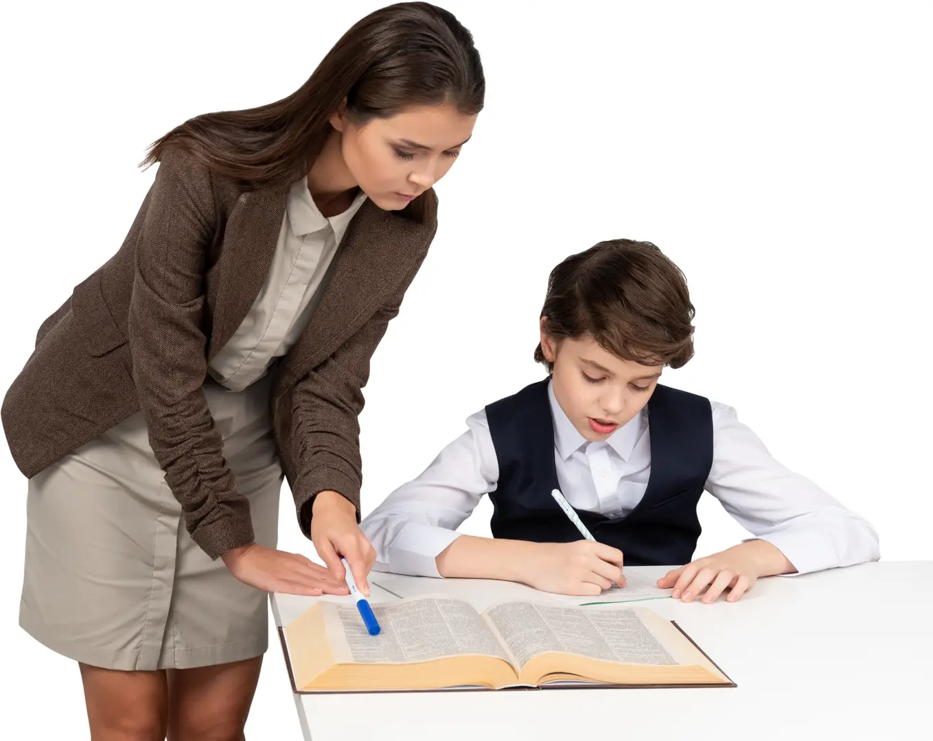 Tutor checking a student's written work at a desk