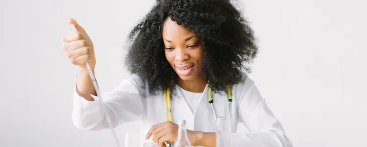 Student holding up a test tube in a science lab