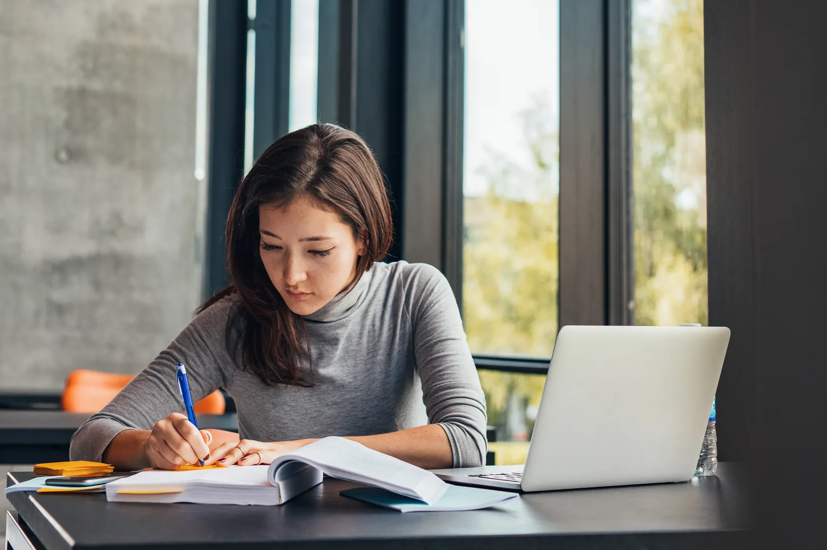 Sixth-form student revising at a desk